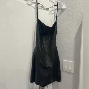 Snake print open back black dress